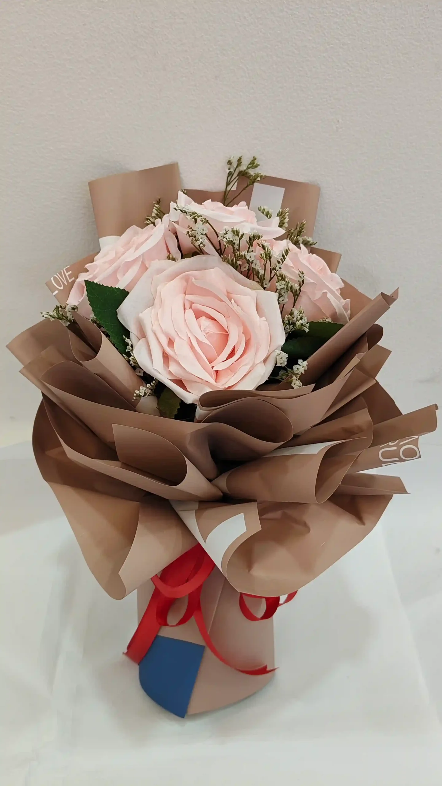 Artificial bouquet.light pink AED.69